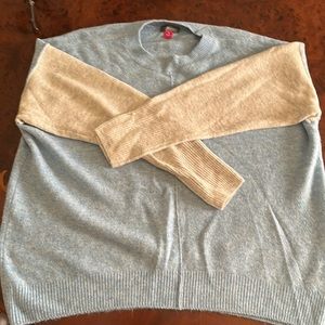 Runs Large. 73% acrylic, 24% polyester, 3% spandex. Hand wash, dry flat.